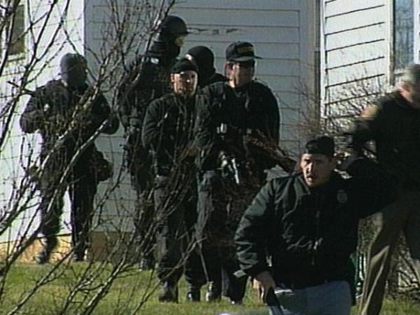 Members of the Durham Sheriff's Department surround an area where they thought Greene was hiding.
