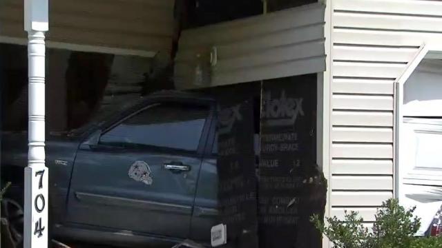 Car crashes into Raleigh home