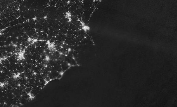 The power outage at Ocracoke and Hatteras islands could be seen from space in images taken by NASA. Here, in an image taken on July 30, the lights are off after the power was knocked out. Photo by NASA