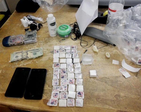 Staff used confidential sources to obtain information and located the following contraband in an inmate canteen: two cell phones and two chargers, $20, crack cocaine, about 1,500 postage stamps, six sandwich bags full of tobacco and several other items. Photo from the North Carolina Department of Public Safety