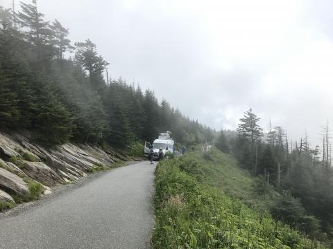 In this shot from our site survey earlier this summer, we’re testing whether we can get our satellite truck up the footpath to the top of Clingmans Dome.