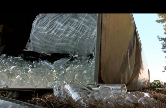 Empty Bacardi Rum bottles spill out of a truck that overturned Friday on I-40.