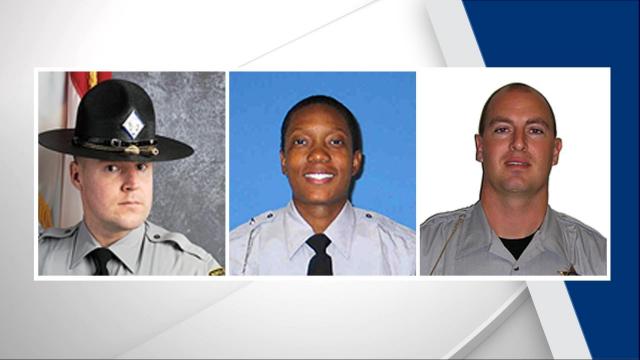 Left to right, State Highway Patrol Troopers Michael Blake and Tabithia Davis and Wake County Sheriff's Office Deputy Cameron Broadwell