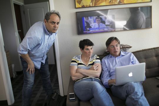 Amy McGrath, a Democratic House candidate, watches election returns with her campaign manager, Mark Nickolas, left, and Mark Putnam, her ad maker, in Richmond, Ky., May 22, 2018. McGrath’s journey from Marine combat pilot to a stunning House Democratic primary victory is a narrative that combines biography, risk taking and the virtues of the digital age. (Maddie McGarvey/The New York Times)
