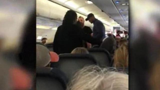 Raw: Passenger escorted off plane after meltdown