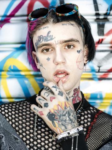 -- PHOTO MOVED IN ADVANCE AND NOT FOR USE - ONLINE OR IN PRINT - BEFORE AUG. 4, 2018. -- FILE -- The rapper Lil Peep in New York, April 17, 2017. For decades, tattoos in highly visible areas, especially the face, were considered the extreme in body art, but they have now become more mainstream on the faces of young rappers and musicians. (Chad Batka/The New York Times)