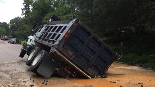 Messy water main break in Cary sinks dump truck