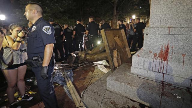 Chapel Hill police chief told officers to 'stay way out' as Confederate monument was toppled; one officer put on leave amid concerns over tattoo