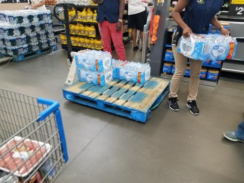Nearly empty pallet of water 