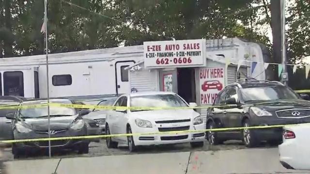 Employee shot during armed robbery at car dealership 
