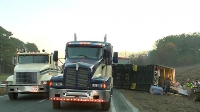 Crews remove overturned tractor trailer from US-64