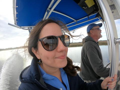 Rachel Bisesi with the North Carolina Coastal Federation surveys the shoreline with Capt. Tim Simpson.  