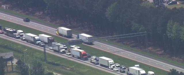 The traffic back-up from a crash after a tractor-trailer collided with a camper.