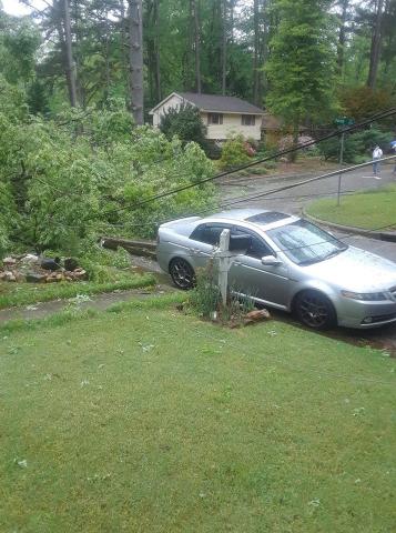 Two large trees fell on a house, damaging a car at a home on Patrick Road and Ward Road in Raleigh. (Photo: William Price Facebook)
