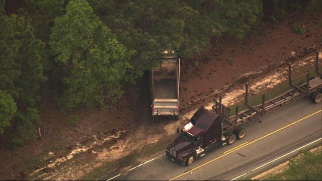 Driver dies after crashing into dump truck near Cameron 