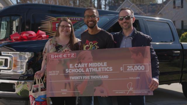 Big surprise! Cary track coach gifted with new truck, $2,500 donation