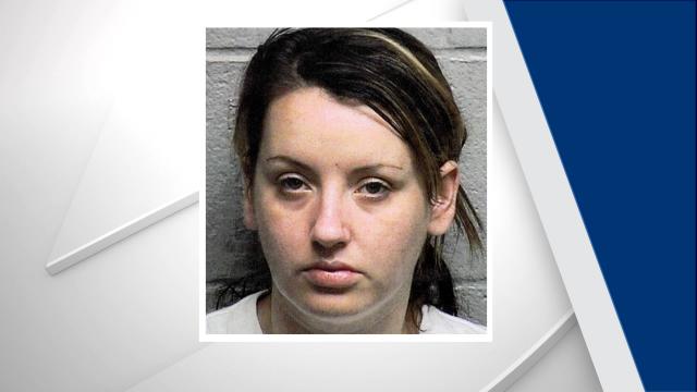 Woman charged in fatal stabbing at Durham motel
