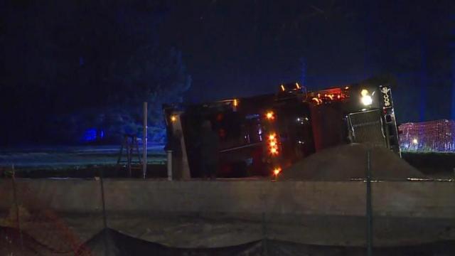 Dump truck overturns in Raleigh