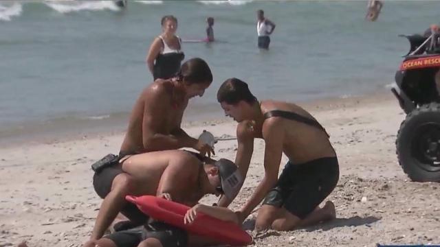 Lifeguards demonstrate rip current rescue 