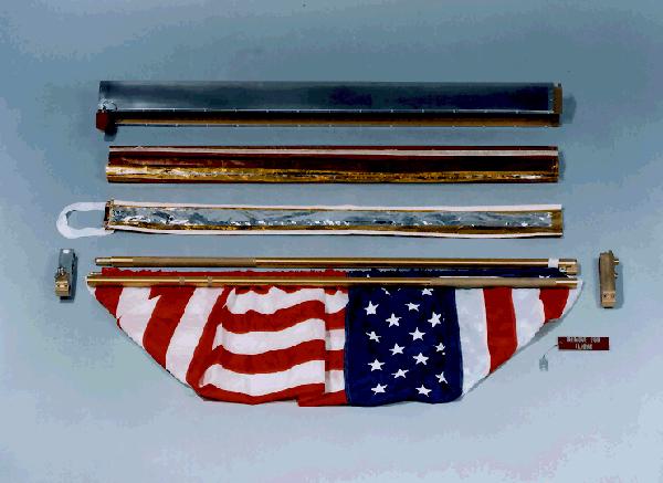 Flag assembly and shroud built to protect the flag from 2,000 degree Fahrenheit temperatures during touchdown.  (NASA photograph S69-38748).