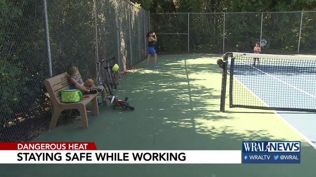 Crews head to work early to beat the heat, while many Triangle residents stay inside