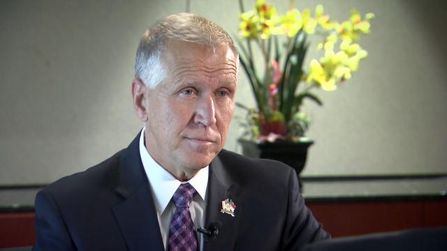 Did Tillis try to remove health coverage for pre-existing conditions?