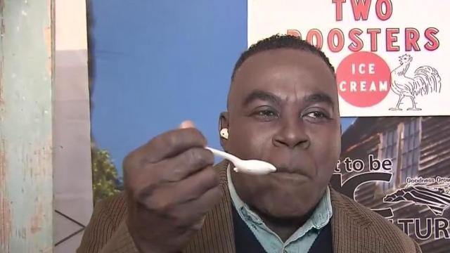 Ken Smith tries pizza ice cream at the NC State Fair