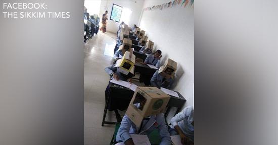Indian students wear boxes on their heads during exam to prevent cheating