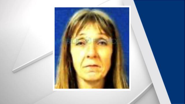 Woman charged after human remains found behind Nash home