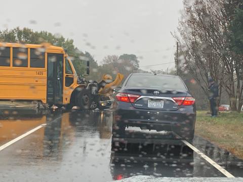 A school bus involved in crash outside Dillard Drive Middle School on Friday morning. Photo by Mikaya Thurmond. 
