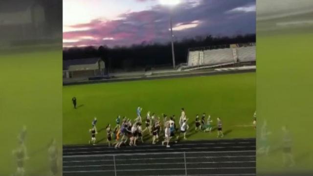 Video shows track students running last lap with child with Down syndrome