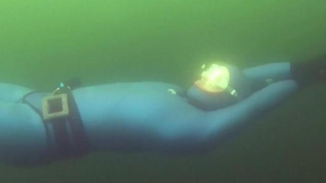 Diver swims under ice covered water, sets world record