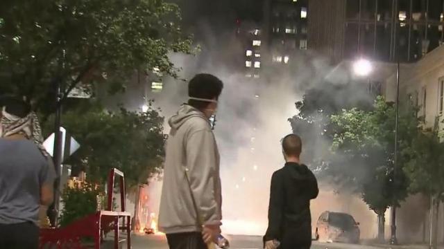 Fire builds and fireworks thrown in downtown Raleigh