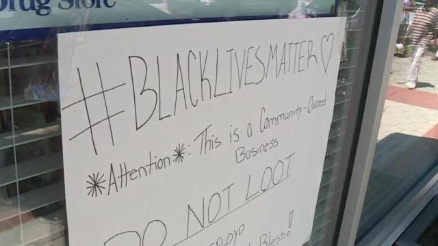 A message for protesters: Wilson businesses hang signs on windows