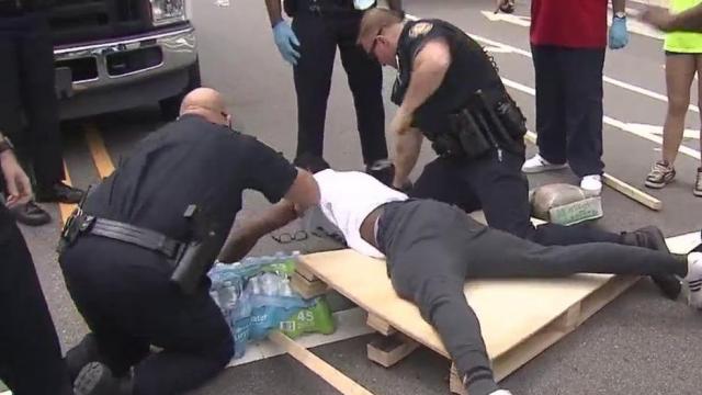 Four people arrested outside Durham police headquarters on 10th day of demonstration 