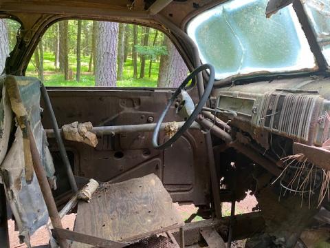 A peek inside the rusted-out stock car abandoned in the woods.