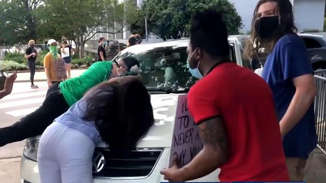Driver who had protesters jump on her car, block her path criticizes Raleigh police, protesters