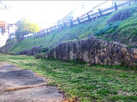 The stone wall and steep incline likely shows the shape of where the stadium bleachers once sat.