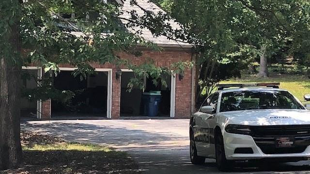 After photos circulated on social media of racial slurs and "KKK" on the garage doors of a Durham home, police were on the scene and the doors raised.