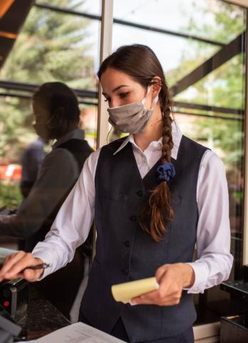 Servers at The Little Nell in Aspen, Colo., wear face coverings.