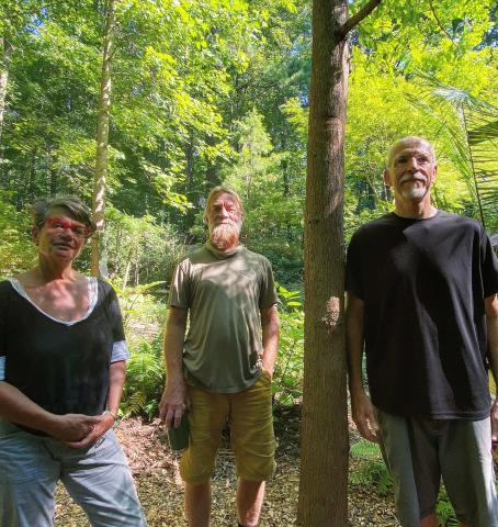 Donna Thome, Charlie Boehlert and David Thome pose with the Redwood they planted and tend to in Raleigh.