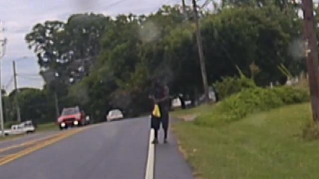 Dash cam footage close-up of mans hands and gun before being shot by Roxboro officer
