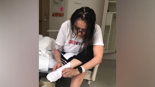 Raw: After weeks in bed, COVID-19 patient relearns everyday tasks