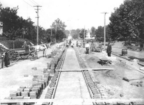 Old photo of streetcar lines being installed. Beneath several Raleigh streets today, old trolley tracks can still be found. (Image courtesy of the State Archives of North Carolina).