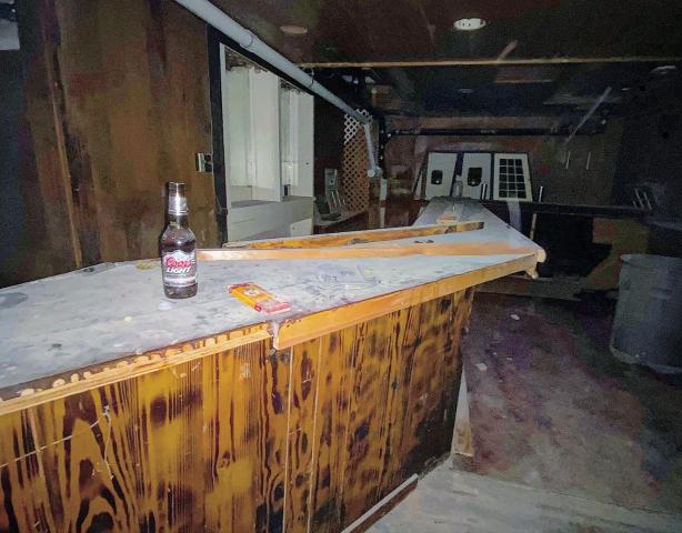 The historic bar has decades of dust covering it.