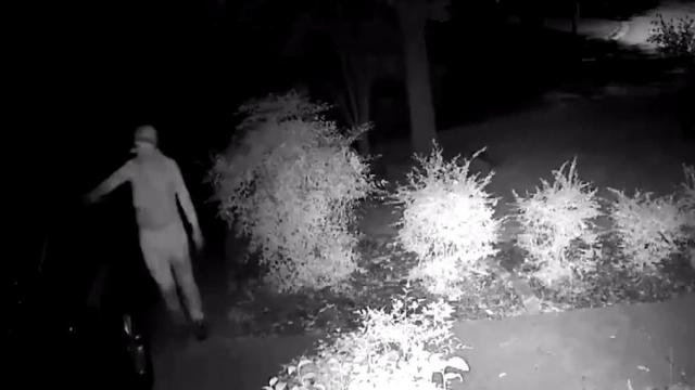 A surveillance camera caught someone seeming to vandalize the property.