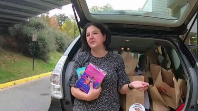 School librarian delivers books to students in distance learning