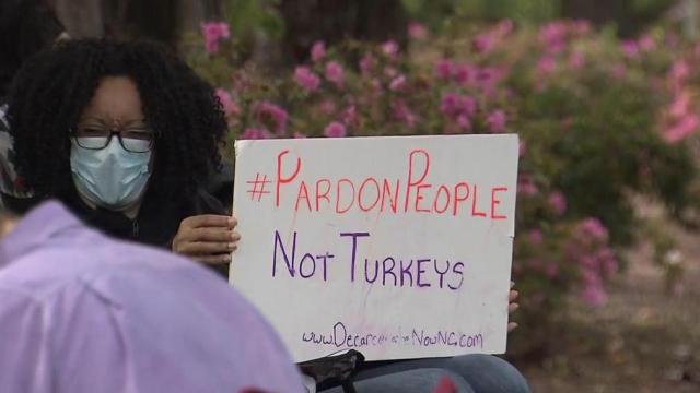 Group protests for governor to pardon people, not turkeys 