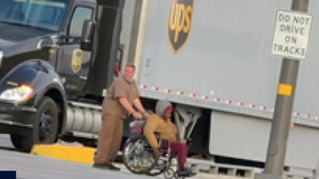 UPS driver saves woman from railroad tracks