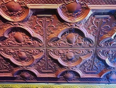 Up-close view of the original tin ceiling and design, which has been there since the 1920s when the Temple Theater was built.